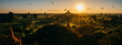 Scenic sunrise with many hot air balloons above Bagan in Myanmar. Bagan is an ancient city with thousands of historic buddhist temples and stupas. panorama, bagan photo