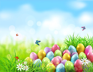 Vector background. Easter eggs in green grass with white flowers, butterflies on blue, blurred , natural background