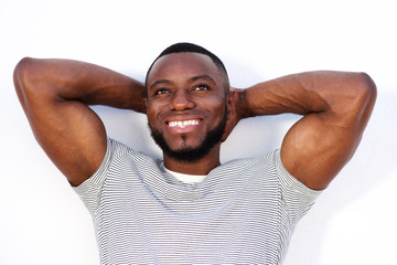 laughing muscular man standing isolated on white background