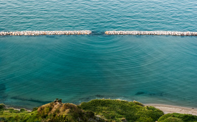 diffraction waves in the sea seen along the coastline near pesaro