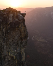 Person Standing On Cliff Edge At Sunset, Yosemite Valley, California, United States Of America 