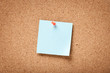 Blue blank sticky note on corkboard