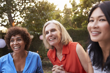 Wall Mural - Mature Female Friends Socializing In Backyard Together