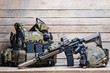 Rifle,flak jacket and helmet/Military bulletproof vest,assult rifle,helmet with night-vision device on wooden background