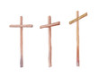 Three crosses stand on  light sky backdrop