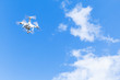 Quadrocopter, compact drone in cloudy sky