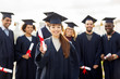 © Syda Productions - happy students in mortar boards with diplomas