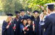 © Syda Productions - students or bachelors photographing by smartphone