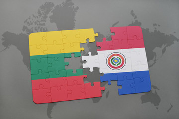 puzzle with the national flag of lithuania and paraguay on a world map