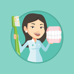 Poster - Dentist with dental jaw model and toothbrush.