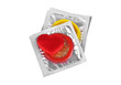 Stack of colored condoms and red heart on a white background
