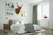 Schlafzimmer mit Hirsch an Wand über Bett