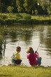 © Designpics - Boy And Girl Fishing On Lakeshore In The Midwest