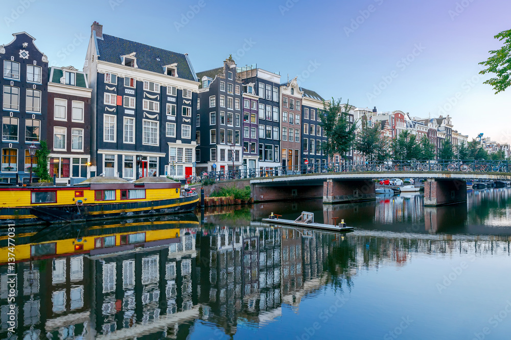 Amsterdam. City Canal at dawn. - obrazy, fototapety, plakaty 