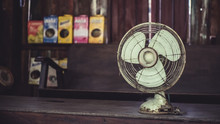 Old Retro Rusty Grunge Metal Blades Portable Fan In Vintage Style Photo.