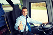 © Syda Productions - happy driver driving bus and snowing thumbs up