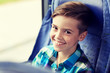 © Syda Productions - happy boy sitting in travel bus or train