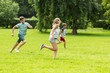 © Syda Productions - group of happy kids or friends playing outdoors