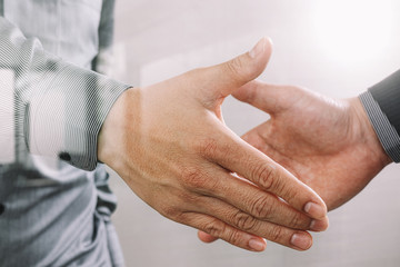 Business partnership meeting concept.photo businessmans handshake. Successful businessmen handshaking after perfect deal.close up,filter