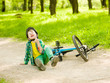 © Ermolaev Alexandr - Boy fell from the bike in a park