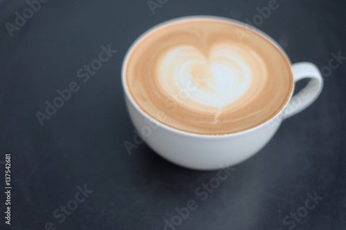 Photographie Vintage latte art coffee. Heart shape latter art in white cup