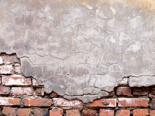 Wall Mural - Damaged brick wall with peeling plaster background for design