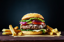 Craft Beef Burger And French Fries On Wooden Table Isolated On Dark Background.