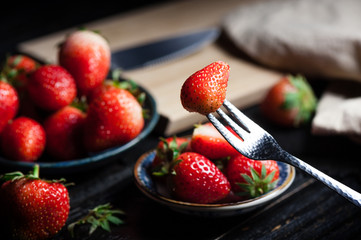 Wall Mural - eating fresh strawberry