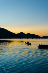 Wall Mural - the silhouettes of lonely fishman at Nai lagoon, Ninh Thuan