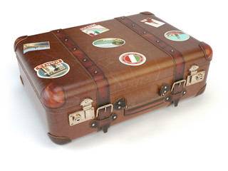 Wall Mural - Retro suitcase beggage with travel stickers isolated on white background.