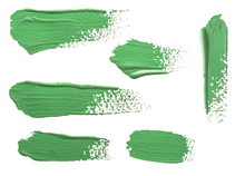 Strokes Of Green Paint Isolated On White Background