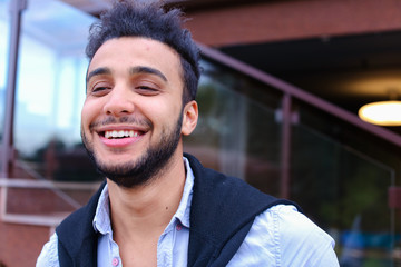 Wall Mural - Portrait of cheerful young male Muslim. Man smiling and posing a