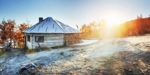 Wall Mural - Cabin in the mountains in winter. Mysterious fog.