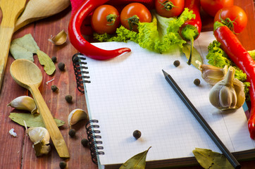 spices, vegetables, and a notebook