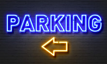 Parking Neon Sign On Brick Wall Background.