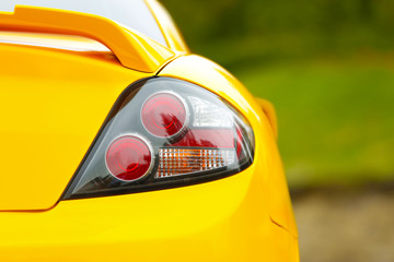 Sticker - Rear light of yellow car, closeup