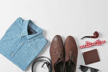 Poster - Flat lay set of male clothes and accessories on white background