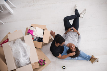 Wall Mural - African American couple relaxing in new house