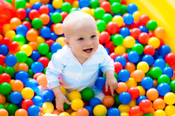 Child playing in ball pit on indoor playground