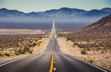 Fototapeta  - Endless straight highway in the American Southwest, USA