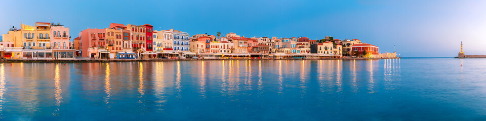 Wall Mural - Picturesque panoramic view of old harbour with Lighthouse of Chania at sunrise, Crete, Greece