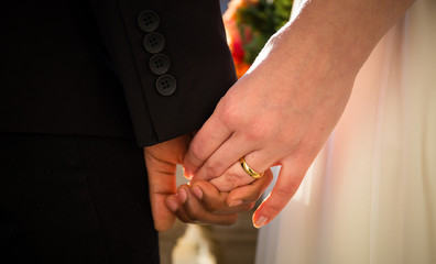 bride and groom hands together