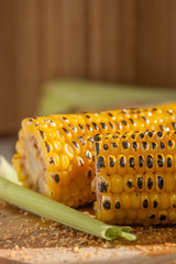 Poster - two grilled corn on a wooden plate