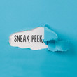 Sneak Peek message on Paper torn ripped opening