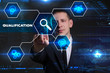 © Egor - Business, Technology, Internet and network concept. Young businessman working on a virtual blackboard of the future, he sees the inscription: qualification