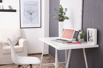 Wall Mural - Comfortable workplace with laptop in office