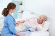 © Africa Studio - Nurse talking with elderly woman in light room