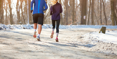 Wall Mural - Couple running in forest