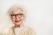 © Yakobchuk Olena - Joyful senior lady in glasses laughing