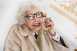 © Yakobchuk Olena - Wealthy old lady having fun in bathroom
